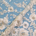 Tissu en dentelle à sequins avec broderie de fleurs de prunier